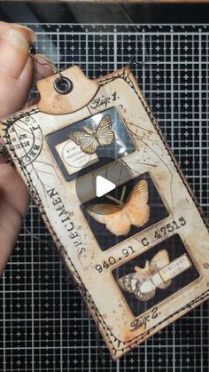 a person holding up a tag with butterflies on it