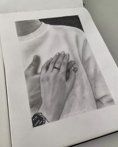 a pencil drawing of two hands holding each other's hand with their fingers together