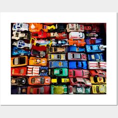 there are many toy cars stacked on top of each other in this photo, all different colors and sizes