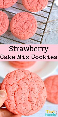 strawberry cake mix cookies on a cooling rack and in the foreground is a hand holding one