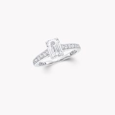 a diamond engagement ring on a white background