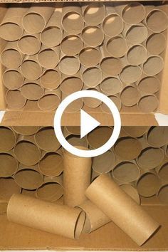 an open cardboard box with several rolls of toilet paper in it and the video below