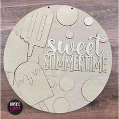 a wooden sign that says sweet summertime with popsicles and ice cream on it