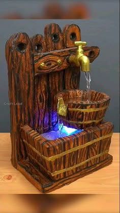 a wooden fountain with water flowing from it