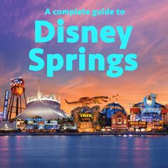 disney springs with the words, a complete guide to disney springs in blue and pink