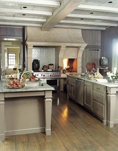 a large kitchen with an island in the middle and lots of counter space around it