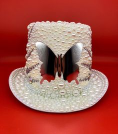 This is a luxury bespoke design and is it is covered in pearl, rhinestones, 3D butterfly decoration and diamante embellishments.  It looks fabulous and will feel fabulous. The ultimate gift to top off your best friends hen party and also all upcoming festivals.  Each hat can be made to order in any size and colors. It can vary to make it match you perfectly so get in touch if you'd like a variation. They can take up to 3 weeks depending on stock levels so if you have an event before then please Hat Burning, Butterfly Decoration, Festival Hat, 3d Butterfly, Man Hat, Butterfly Decorations, Silver Mirror, Costume Hats, The Ultimate Gift