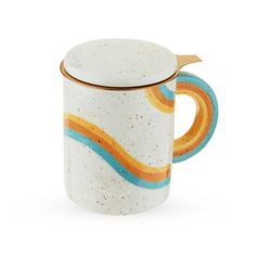 a ceramic mug with an orange and blue handle