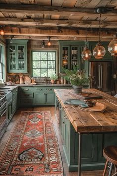 a kitchen with green cabinets and an area rug on the floor in front of it