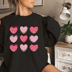 Whether you're planning a romantic dinner or a casual date, this Valentine's Day Crewneck Sweatshirt effortlessly combines style and comfort. The relaxed fit provides versatility, allowing you to pair it with your favorite jeans, leggings, or skirts, creating a variety of fashionable ensembles. Garment Types & Features 💞Gildan Crewneck 1800 Unisex Heavy Blend Crewneck Sweatshirt💞 Medium-heavy fabric (8.0 oz/yd² (271.25 g/m Loose fit Runs true to size 50% cotton, 50% polyester Sewn-in label 💞B Valentine's Day Gift Sweatshirt, Cute Long Sleeve T-shirt For Valentine's Day, Valentine's Day Long Sleeve Sweatshirt With Heart Graphic, Cute Long Sleeve Tops For Valentine's Day, Heart Graphic Long Sleeve Top As Gift, Long Sleeve Tops With Heart Graphic For Gift, Long Sleeve Tops With Heart Graphic As Gift, Valentine's Day Gift Top With Long Sleeves, Valentine's Day Cute Long Sleeve Tops