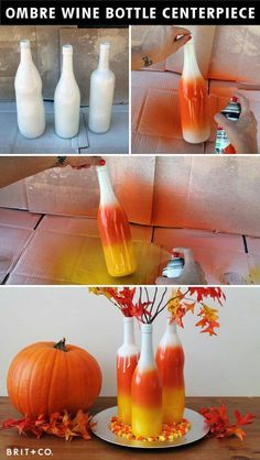 some bottles with orange liquid in them sitting on a table next to pumpkins and leaves