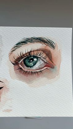 a watercolor painting of a woman's eye