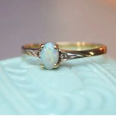 The Pictures Tell The Story! Lovely 14k Yellow Gold Ring With Prong Set Opal Gemstone Small Sparkling Diamond Set On Each Side Opal Is Filled With Color And Depth Stamped 14k Woman’s Size 6 Lightweight But Sturdy Feel Free To Ask Any Questions. Offers Always Welcome Take Very Good Care. Raw Opal Engagement Ring, Opal Wedding Ring, Opal Ring Vintage, Opal Ring Gold, Sparkling Diamond, Diamond Set, Opal Ring, Yellow Gold Ring, Sparkle Diamonds