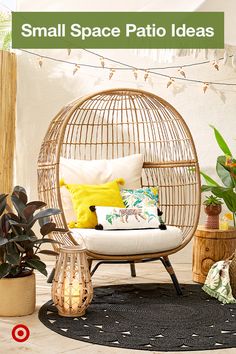 a rattan swing chair with pillows and plants