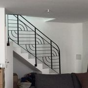 a living room filled with furniture and a stair case