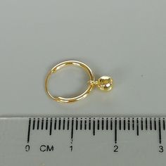 A PAIR of sterling silver hoops plated in gold. Comes with a tiny gold ball charm. Dimensions: Hoops 12 x 1 mm. Ball: 4mm Drop length: 15mm Price listed is for ONE PAIR These are made of 925 hypoallergenic sterling silver dipped in gold. Most of my pieces come with a 925 stamp. Can be packaged in a gift box. I can include a personal message from you if needed You are welcome to contact me at... bhavnakwintra1956@gmail.com For more beautiful pieces from my shop, please browse 👇 TOE RINGS: https: Minimalist Hoop Earrings With Charms, Minimalist Round Hoop Earrings With Charms, Hoop Charms, Earrings Minimalist, Bohemian Earrings, Sterling Silver Hoops, Gold Hoops, Toe Rings, Elegant Earrings