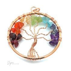 Beautifully wire-wrapped Tree of Life pendant with chakra stones. It comes in a variety of metal color options. Perfect for a chain or a cord! Materials: Mixed Metals with crystals Dimensions: 40mm wide, 52mm long including bail Note: Not Gold, Rose Gold, or .925 Sterling Silver Adjustable Copper Wire Crystal Necklaces For Healing, Spiritual Multicolor Wire-wrapped Crystal Necklaces, Spiritual Wire Wrapped Multicolor Crystal Necklaces, Spiritual Multicolor Wire Wrapped Crystal Necklaces, Wire Wrapped Spiritual Jewelry, Spiritual Wire-wrapped Metal Crystal Necklace, Spiritual Wire Wrapped Jewelry, Spiritual Style Wire Wrapped Jewelry, Rainbow Wire Wrapped Round Jewelry