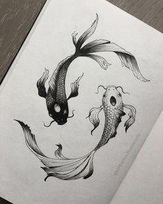 a drawing of two koi fish in the shape of a skull on top of each other