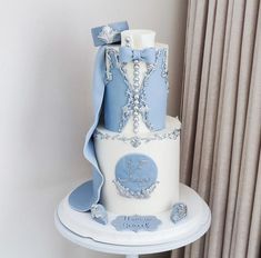 a blue and white cake on a table