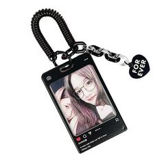 a keychain with a photo on it that has a heart shaped tag attached to it