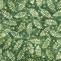 a green and white leaf pattern on fabric