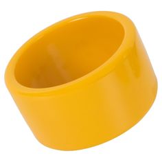 This is a great-looking yellow creamed corn Bakelite bracelet bangle. It boasts an extra-wide sliced shape and an intense, bright, plain yellow color. Measurements: Inside across is 2.63 in diameter (6.7 cm) - outside across is 3.19 in diameter (8.1 cm) - width is 1.69 in wide (4.3 cm). The inner circumference of the bracelet is 8.28 in (21.04 cm). Please double-check the measurements and ask any questions before making your purchase. This item is a final sale, and we will not accept returns for Antique Bangles, Sapphire Bangle, Plain Yellow, Modern Bangle, Classic Bangles, Lucite Bracelets, Bakelite Bracelets, Creamed Corn, Antique Bracelets