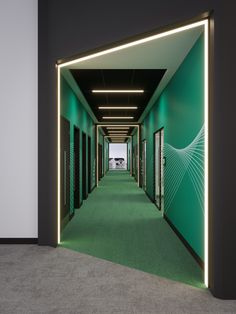 an empty hallway with green walls and white trim on the doors is lit by neon lights