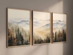 three paintings hanging on the wall in an empty room