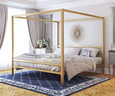 a bedroom with a four poster bed, dresser and mirror on the wall above it