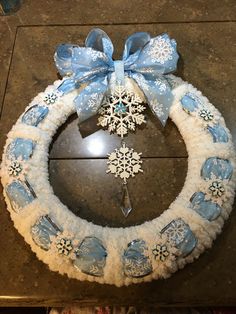 a blue and white wreath with snowflakes on it