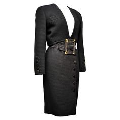 Circa 1988/1992 France Iconic Yves Saint Laurent Rive Gauche skirt suit in wool fashioned with large parallel ribs Circa 1988/1992. High-waisted shoulder bolero with large polished jai buttons, gold-tone brass rims on the cuffs, with a recall on the right skirt with a cross-sided wallet. Wide belt in elastic silk trim with rectangular buckle in brass knotted with black cords. No damage. Excellent state of color and preservation. Measurement: Equivalent French size 38 ( indicated size 40). Bolero height 42 cm, shoulders 41 cm, sleeves 59 cm, size 87 cm. Skirt height 60 cm, size 69 cm. Ysl Dress, Vintage Skirt Suit, Suits Outfits, Versace Pink, Houndstooth Skirt, Jersey Skirt, Black Houndstooth, Chic Leather, Shades Of Turquoise