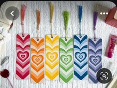 colorful tags with hearts and arrows on them