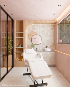 a spa room with two white chairs facing each other in front of a wall mounted mirror