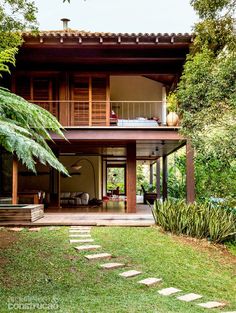 a house that is surrounded by trees and plants