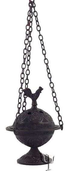 an old fashioned bird feeder hanging from a chain