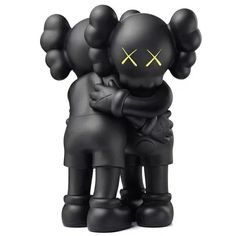 two black figurines are hugging each other