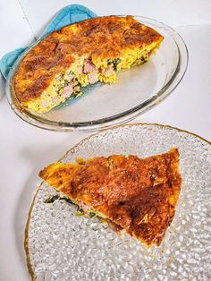 a slice of quiche sitting on top of a glass plate next to another pie