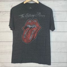 the rolling stones t - shirt on a hanger