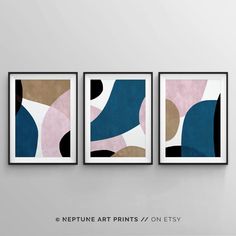 three framed art prints hanging on a wall