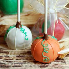 two cake pops with the word love on them