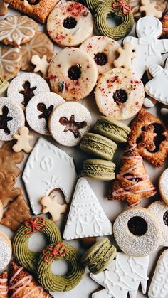 many different types of cookies and pastries on display