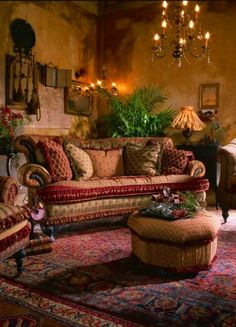 a living room filled with lots of furniture next to a fire place covered in christmas decorations