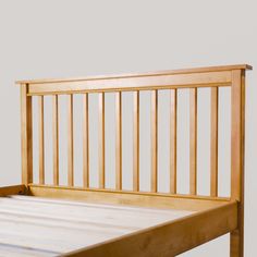 a wooden bed frame with slats on the top and bottom sides, against a white background