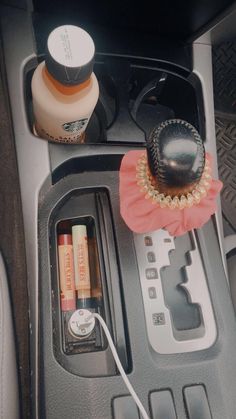 the interior of a car with an air freshener dispenser and other items