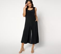 The easiest, chicest look in your summer getaway bag? This Attitudes by Renee® Collection sleeveless jumpsuit in stretchy, fluid, and practically wrinkle-resistant Como Jersey! Add a fab pair of sandals (or sneaks), a shiny chain, some oversized sunnies, or whatever floats your boat -- the cropped wide-leg style is the need-now blank canvas for your dream vacation or summer staycation. And, because smart pieces work overtime, it's office-ready with the simple addition of a blazer or cardi fr Versatile Sleeveless Jumpsuits And Rompers For Loungewear, Chic Stretch Summer Jumpsuits And Rompers, Versatile Sleeveless Jumpsuits For Spring, Versatile Sleeveless Jumpsuits And Rompers For Spring, Spring Sleeveless Jumpsuits And Rompers, Versatile Summer Jumpsuits And Rompers For Loungewear, Versatile Spring Stretch Jumpsuits And Rompers, Versatile Stretch Jumpsuits And Rompers For Spring, Versatile Sleeveless Jumpsuits For Work