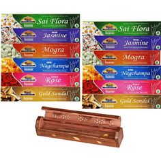 three packages of incense sticks with different flavors and colors on the front, two are in wooden boxes