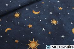 the sun and stars are on blue fabric