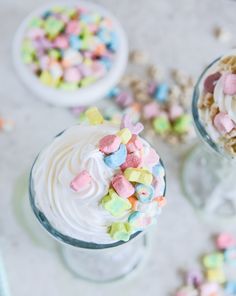 there are two desserts with marshmallows on the top and candy in the bottom