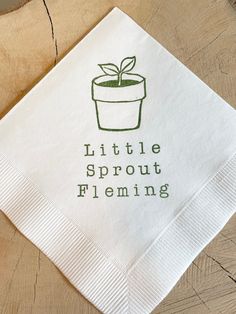 a little sprout fleming paper napkin with a potted plant on it