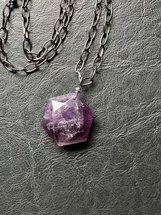 My best-selling badass hexagon stone pendants are back! I carefully wrapped this gorgeous ametrine amethyst and suspended it from a badass large link gunmetal chain. This necklace closes with a lobster claw clasp. This piece is beautiful and high quality. Perfect to layer or as a armament on its own! Necklace adjustable up to 18" Pendant measures 1.5" Amethyst is believed to be a protective stone that clears your mind of negative thoughts, stress and anxiety. Amethyst is believed to be a powerful protective crystal with great energy. It may bring calmness and clarity to its wearer. Designed and handcrafted by Cracked Halo Design. This listing is for the exact necklace in the first four photos. Necklace shown on model is for size reference. Find the rest of this unique collection in the sho Halo Design, Necklace Gemstone, Gemstone Necklace Pendant, Negative Thoughts, Minimalist Jewelry, Stone Pendants, Lobster Claw, Citrine, Favorite Jewelry